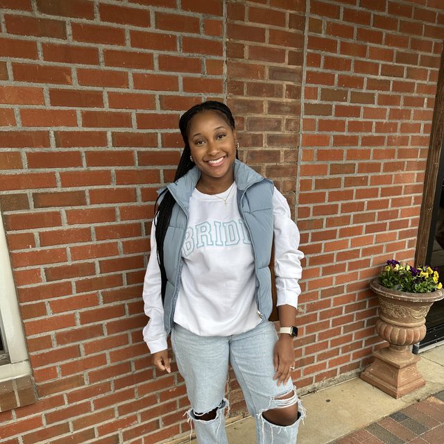 Customer wearing a custom embroidered bride sweatshirt