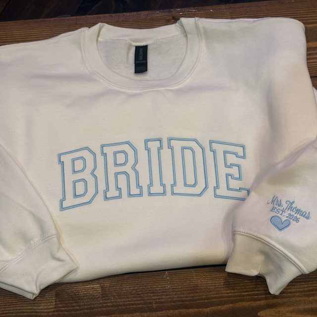 Custom embroidered bride sweatshirt, flat lay