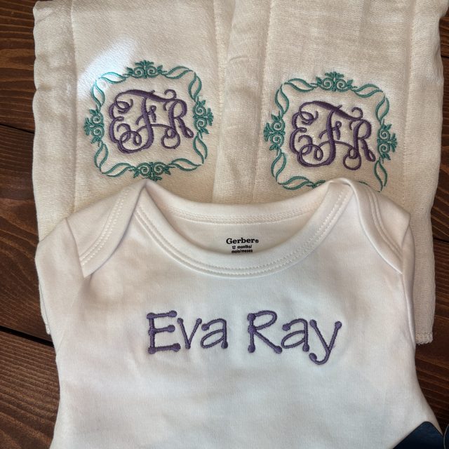 Personalized embroidered baby onesie and burp cloths