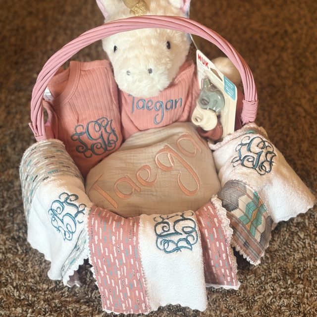 Personalized baby gift basket with embroidered items