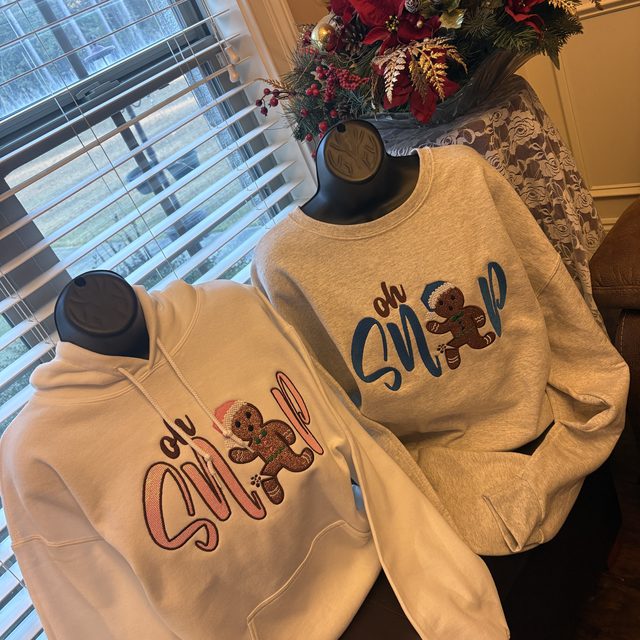 Custom embroidered holiday hoodies in two colors